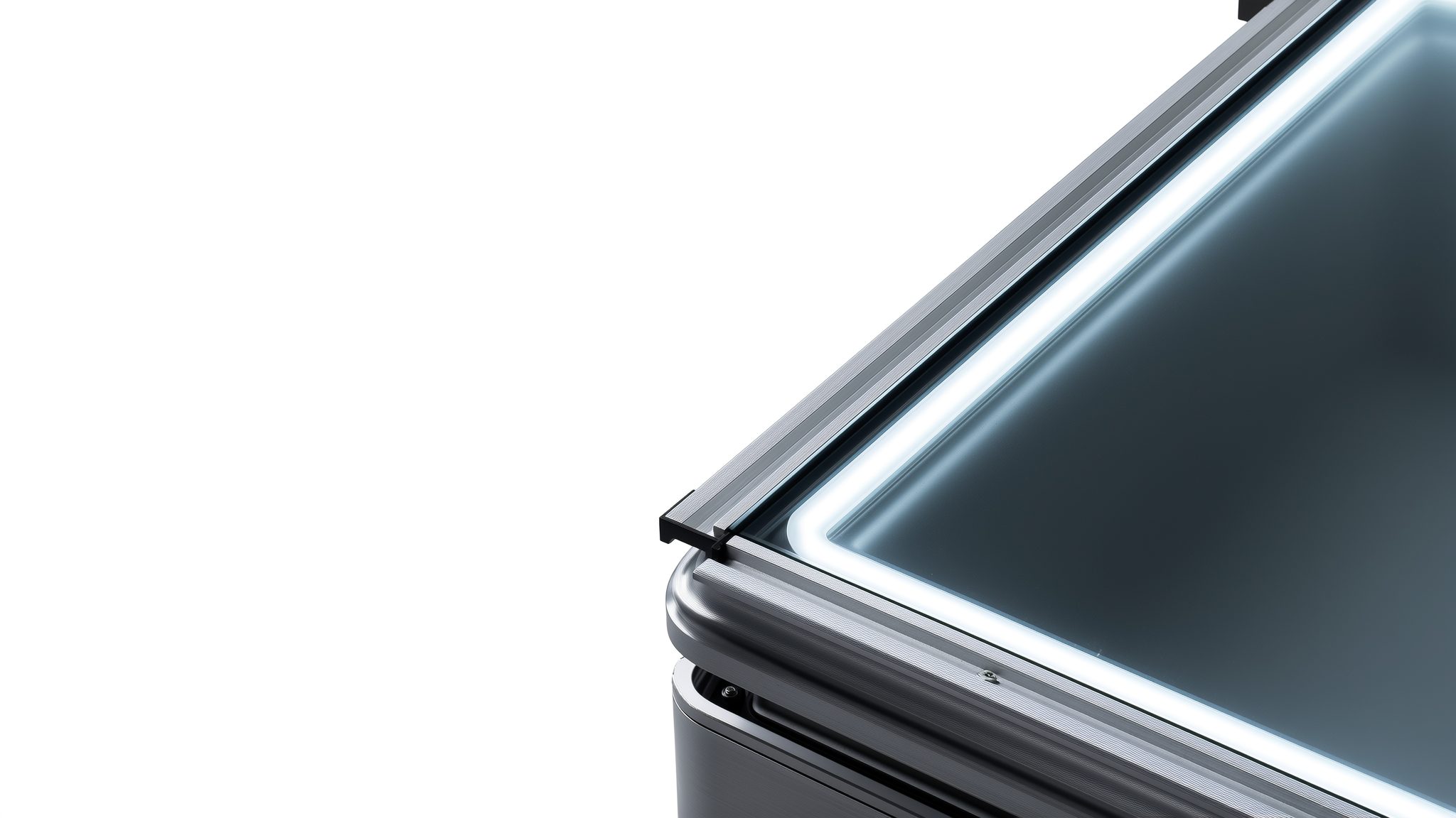 Close-up of a sealed enclosure with a lit frosted-glass lid